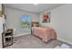 Bedroom featuring a desk, carpeted floors, and a painting of a flower at 474 Rio De Janeiro Ave, Punta Gorda, FL 33983