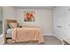 Bedroom featuring a bed, carpeted floors, and a painting of a flower at 474 Rio De Janeiro Ave, Punta Gorda, FL 33983