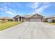 Charming single-Gathering home with three-car garage, well-maintained lawn, and inviting curb appeal at 474 Rio De Janeiro Ave, Punta Gorda, FL 33983