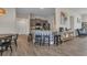 Kitchen island featuring decorative tiling, barstool seating, and modern countertops adjacent to the dining area at 474 Rio De Janeiro Ave, Punta Gorda, FL 33983