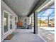 Inviting outdoor lanai featuring covered patio area with tiled flooring and comfortable seating at 474 Rio De Janeiro Ave, Punta Gorda, FL 33983