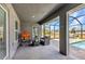 Inviting outdoor lanai featuring covered patio area with tiled flooring and comfortable seating at 474 Rio De Janeiro Ave, Punta Gorda, FL 33983