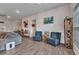 Bright living space with wood-look tile, comfortable seating, and stylish decor at 474 Rio De Janeiro Ave, Punta Gorda, FL 33983