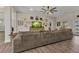Cozy living room featuring a comfortable sofa, stylish decor, and a large television at 474 Rio De Janeiro Ave, Punta Gorda, FL 33983