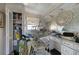 Bathroom with white cabinets, a large mirror, and a shower, showing water damage and items strewn about at 490 Via Esplanade, Punta Gorda, FL 33950