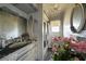 Bathroom with extensive damage from fire and soot on walls, ceiling and vanity at 490 Via Esplanade, Punta Gorda, FL 33950