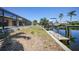 Backyard with enclosed pool, canal view and dock with boat lift at 490 Via Esplanade, Punta Gorda, FL 33950