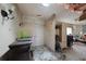 Entryway with a set of double doors, decorative lighting and some ceiling and wall damage at 490 Via Esplanade, Punta Gorda, FL 33950
