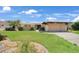 Charming single-story home with well-maintained lawn and inviting curb appeal at 490 Via Esplanade, Punta Gorda, FL 33950