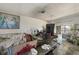 Living room with a sliding glass door and an adjacent area with some ceiling damage at 490 Via Esplanade, Punta Gorda, FL 33950