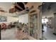 Spacious living room with a view to an adjacent room with some ceiling damage at 490 Via Esplanade, Punta Gorda, FL 33950