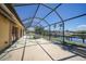 Enclosed pool area with water and canal view and large patio, needs cleaning at 490 Via Esplanade, Punta Gorda, FL 33950
