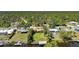 Waterfront property with a private dock and lush landscaping in a serene setting at 552 Mccabe St, Port Charlotte, FL 33953