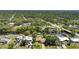 Waterfront property featuring lush trees, a private boat dock, and backyard canal access at 552 Mccabe St, Port Charlotte, FL 33953