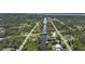 Aerial view of a canal community, surrounded by trees and foliage at 552 Mccabe St, Port Charlotte, FL 33953