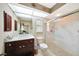 Bright bathroom featuring a glass shower, modern fixtures, and vanity storage at 552 Mccabe St, Port Charlotte, FL 33953