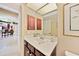 Bathroom with vanity and view to the kitchen at 552 Mccabe St, Port Charlotte, FL 33953