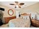 Bedroom featuring ceiling fan, and wooden furniture at 552 Mccabe St, Port Charlotte, FL 33953