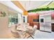 Bright breakfast nook featuring stainless steel refrigerator and views of the backyard at 552 Mccabe St, Port Charlotte, FL 33953