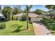 Charming home featuring a brick driveway and attached two-car garage at 552 Mccabe St, Port Charlotte, FL 33953