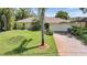 Charming home featuring a brick driveway and attached two-car garage at 552 Mccabe St, Port Charlotte, FL 33953