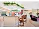 Open concept kitchen offers counter seating and clear view of the living room and backyard at 552 Mccabe St, Port Charlotte, FL 33953