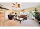 Spacious living room with arched windows, comfortable seating, and stylish decor at 552 Mccabe St, Port Charlotte, FL 33953