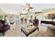 Open-concept living room connects dining area, kitchen with a breakfast bar, and relaxed seating at 552 Mccabe St, Port Charlotte, FL 33953