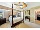 Bedroom with a four-poster bed, neutral color scheme, and view of closet space at 552 Mccabe St, Port Charlotte, FL 33953