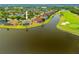 Aerial of home located on waterfront and golf course offering stunning views from the backyard at 624 Planters Manor Way, Bradenton, FL 34212