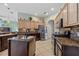 Modern kitchen with granite countertops, stainless steel appliances, and center island at 624 Planters Manor Way, Bradenton, FL 34212