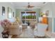 Comfortable living room with neutral decor, plush seating, and views of the outdoors, creating a relaxing atmosphere at 624 Planters Manor Way, Bradenton, FL 34212