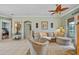 Comfortable living room with stylish decor, a ceiling fan, and access to a patio at 624 Planters Manor Way, Bradenton, FL 34212