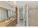 Bathroom featuring a granite countertop, vanity, shower, mirror, and neutral color scheme at 1137 Ponderosa Rd, Venice, FL 34293