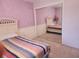Bright bedroom with mirrored closet doors, carpet, and a quaint furniture arrangement at 1137 Ponderosa Rd, Venice, FL 34293