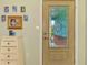 Close-up of the front door showcasing the decorative glass and interior foyer at 1137 Ponderosa Rd, Venice, FL 34293