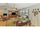 Comfortable living room with bay windows, a ceiling fan, and stylish decor at 1137 Ponderosa Rd, Venice, FL 34293