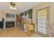 Living room with fireplace, wood floors, and plenty of room for storage and activities at 1137 Ponderosa Rd, Venice, FL 34293