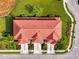 Birds eye view of the red tile roof, lush landscaping, and inviting driveways at 1156 Jonah Dr, North Port, FL 34289
