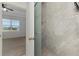 Luxurious bathroom with glass door shower and backyard view at 1156 Jonah Dr, North Port, FL 34289