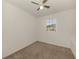 Empty bedroom with neutral walls and carpet, a ceiling fan, and a window with natural light at 1156 Jonah Dr, North Port, FL 34289