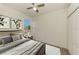 Stylishly staged bedroom featuring a ceiling fan, a sunlit window, and closet at 1156 Jonah Dr, North Port, FL 34289