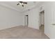 Large bedroom with neutral carpeting, ceiling fan, and bright white walls at 1156 Jonah Dr, North Port, FL 34289