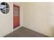 A welcoming front entry with a unique round window on an appealing red door at 1156 Jonah Dr, North Port, FL 34289