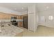 Spacious kitchen boasting granite counters, stainless appliances, and ample cabinet space at 1156 Jonah Dr, North Port, FL 34289