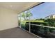 Enclosed lanai showing serene views of the surrounding lush green space and vegetation at 1156 Jonah Dr, North Port, FL 34289