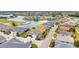 Aerial view of a home in a lakeside community with well-manicured landscaping at 1751 Nottingham Trl, Punta Gorda, FL 33980