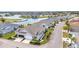 An aerial view of a home with a beautiful lake and golf course view at 1751 Nottingham Trl, Punta Gorda, FL 33980