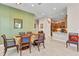 Open-concept dining area featuring wood table and a view into the kitchen at 1751 Nottingham Trl, Punta Gorda, FL 33980