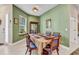 Dining room with green accent wall and furniture at 1751 Nottingham Trl, Punta Gorda, FL 33980